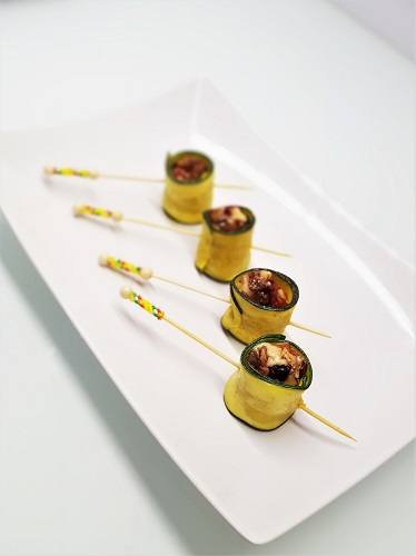 Zucchini and cheese tapas with dried fruits and nuts