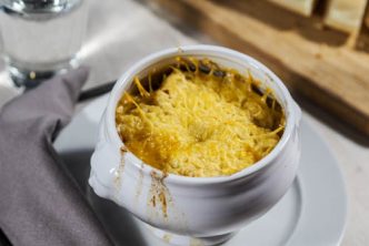 Classic French onion soup with bread and broiled cheese