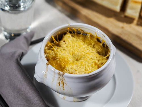 Classic French onion soup with bread and broiled cheese
