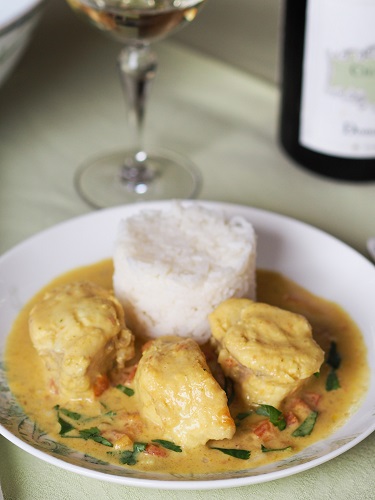 white fish with curry and coconut sauce