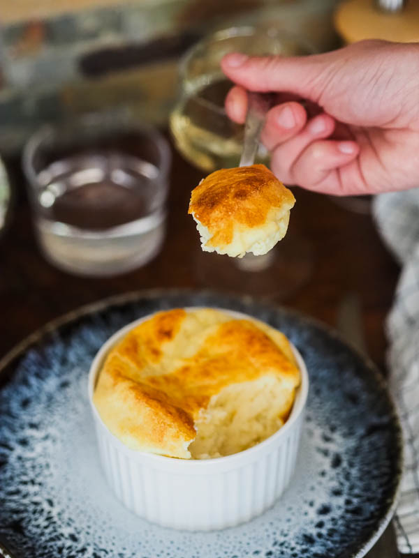 a bite of generous cheese souffle