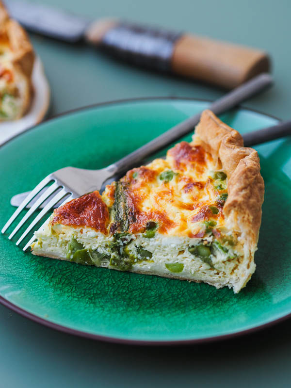 a slice of quiche made with seasonal vegetables for a light and delicious lunch