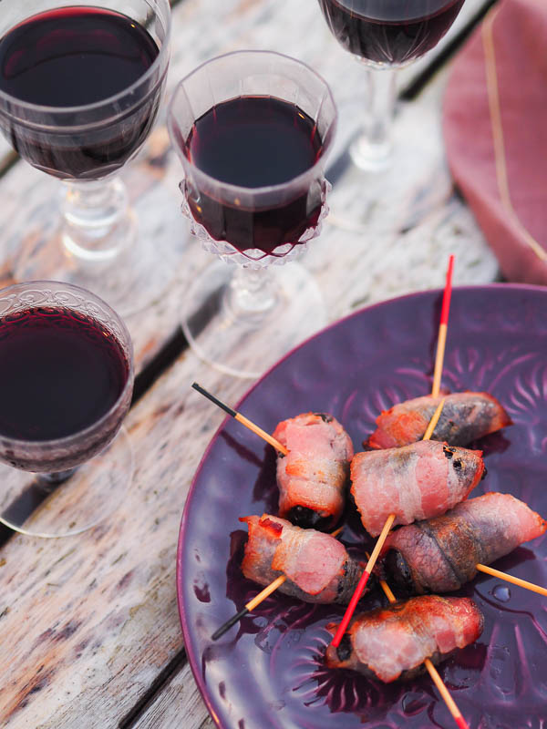 apéro time, red wine and bacon wrapped prunes
